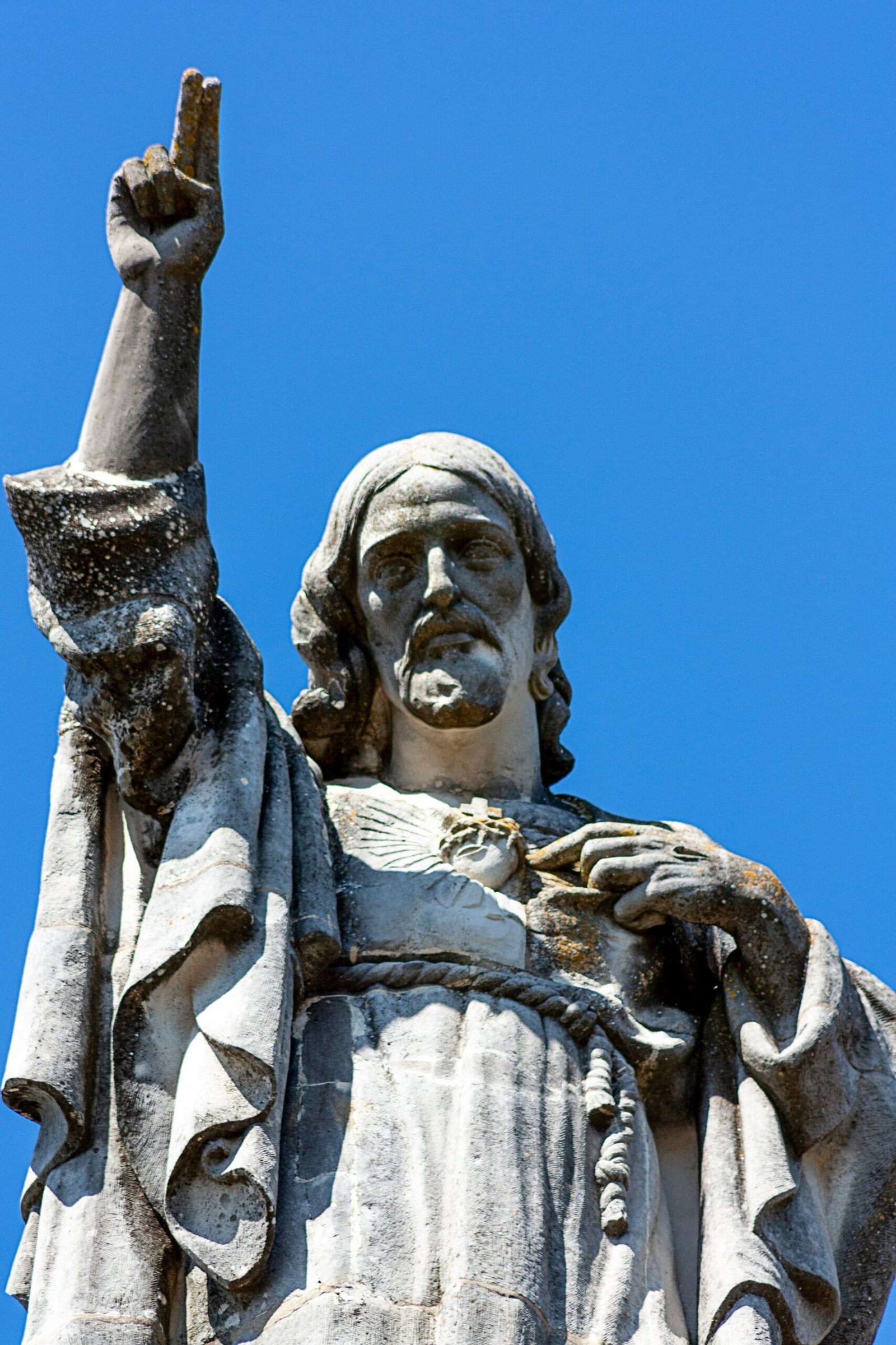 gray concrete statue under blue sky during daytime